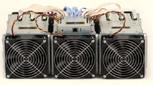 A close-up shot of a mining rig's cooling fans working to dissipate heat.